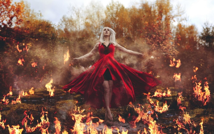 Woman in red sleeveless dress standing on burning ground HD wallpaper | Wallpaper Flare
