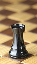 https://upload.wikimedia.org/wikipedia/commons/thumb/1/19/Chess_piece_-_Black_rook.JPG/131px-Chess_piece_-_Black_rook.JPG