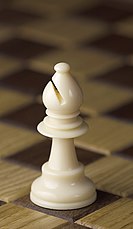 https://upload.wikimedia.org/wikipedia/commons/thumb/1/1d/Chess_piece_-_White_bishop.JPG/133px-Chess_piece_-_White_bishop.JPG