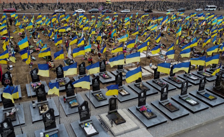 Amid sea of Ukrainian flags, Mariupol defender finally laid to rest | Reuters