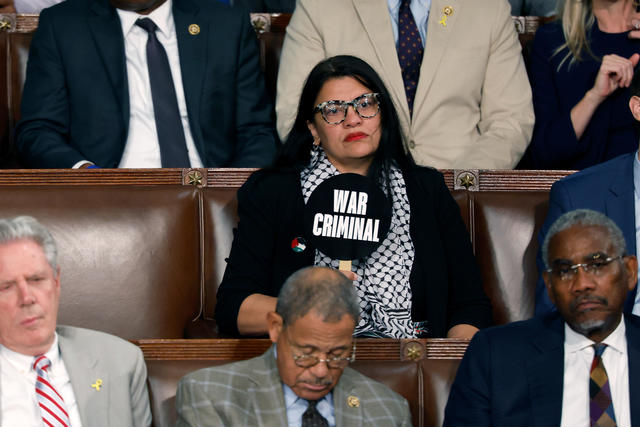 Rep. Rashida Tlaib holds "war criminal" sign during Benjamin Netanyahu's speech to Congress - CBS Detroit