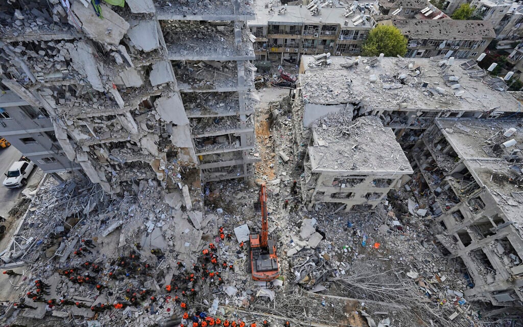 Israeli soldiers search through the rubble of residential buildings destroyed by an Iranian missile strike in Bat Yam, central Israel, June 15, 2025. (AP Photo/Baz Ratner)